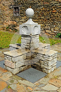 Drinking water source in As Eiras village on the Camino de Santiago towards the town of Laza, Orense province, Spain photo