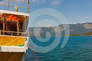 CAMLI, MUGLA, TURKEY: Pier in Camli village with boats departing for Kleopatra island in the Gulf of Gokova photo