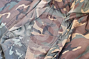Camouflage background texture as backdrop for hunting or fishing design projects
