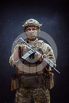 Camouflaged Man Holding Rifle