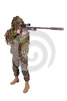 Camouflaged sniper in ghillie suit