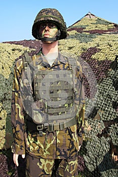 Camouflaged soldier photo