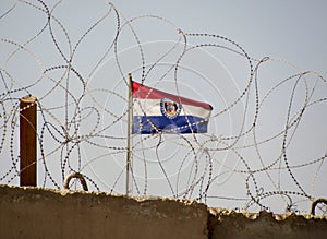 Camp Cropper Wall Iraq with Missouri Flag in back ground