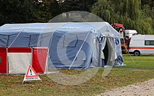 Camp equipped with a tent and warning signs and the text in Italian which means CIVIL PROTECTION photo