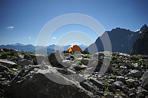 Camp high in mountains. Travelling background. Summer outdoor activity. Adventure time. Sport and relax.