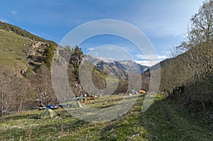 Camp of tourists-watermen on the banks of the mountain river