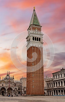 Campanile bell tower on St. Mark`s square in center of Venice at sunrise, Italy