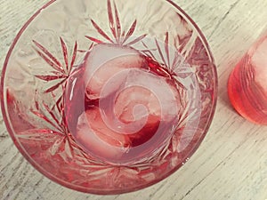 Campari served in two crystal glass with ice cubes