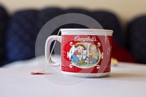 A Campbell\'s coffee mug with a tea bag
