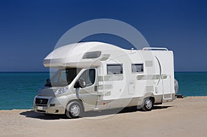 Camper parked on the beach photo