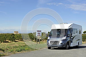 Camper at a road in France near a vineyard