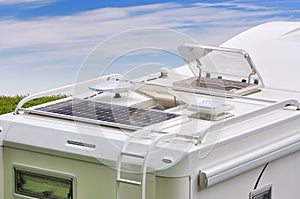 Camper roof with solar panel, antenna, oblo and ladder