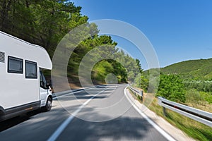 Camper trailer on Highway. road trip in motorhome