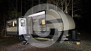 Camper trailer at a late fall campsite