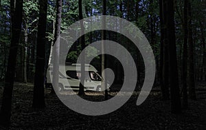 Camper Van Camping Inside the Forest During Night Time
