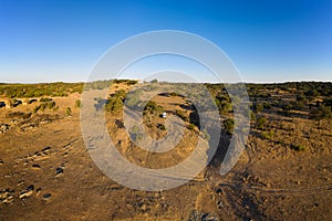 Camper van drone aerial view alone on an Alentejo landscape between the trees