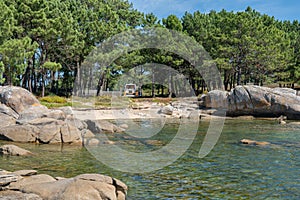 Camper van living van life in a wild beach of Arousa island in Galicia, Spain