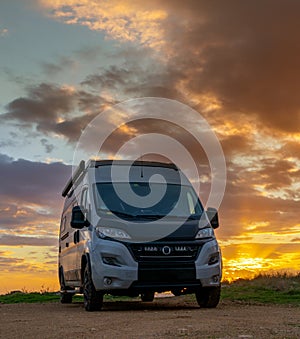 camper van parked on the shores of the Gulf of Taranto in Apulia at sunset