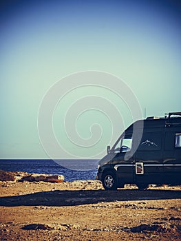 Camper van on sea cliff, camping