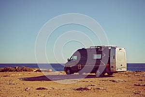 Camper van on sea cliff, camping