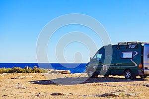 Camper van on sea cliff, camping