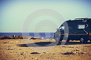 Camper van on sea cliff, camping