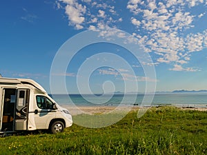 Camper van on sea shore, Lofoten Norway