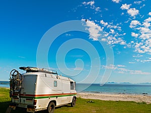 Camper van on sea shore, Lofoten Norway