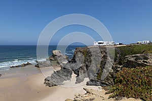 Campers parked on a cliff near the village of Porto Covo, in the Costa Vicentina Natural Park in Portugal photo