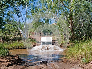 Campervan crossing river in Australia