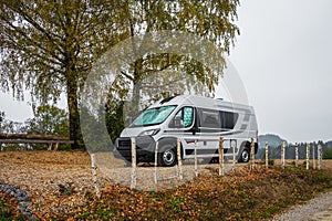 Campervan or motorhome parked in the countryside in nature.