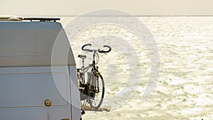Caravan van with bicycle on rack back