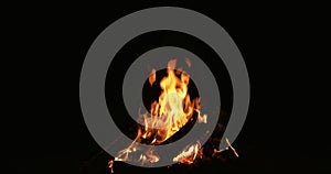 Campfire on black fire flame orange logs blaze
