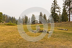 Campfire at a campsite in a meadow