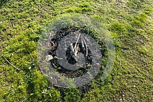 Campfire, fireplace with frame of branches and stones