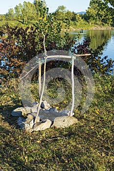 Campfire, fireplace with frame of branches and stones