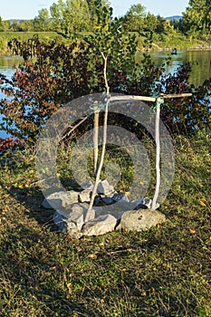 Campfire, fireplace with frame of branches and stones