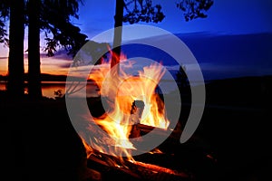 Campfire by a lake photo