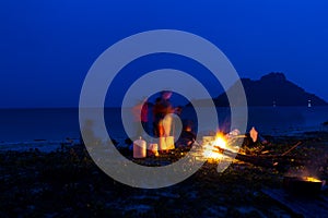 Campfire in night on the beach during the summer