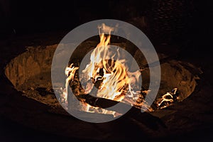 Campfire at touristic camp at nature in mountains