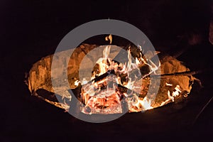 Campfire at touristic camp at nature in mountains