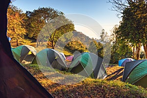 Campground Adventure With Camping Tent of Tourist Backpack, Resting Campfire Picnic at The Highland With Nature Landscape Scenery