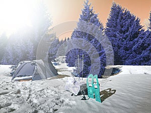 Campin on snow. Tent set on frozen snowy lake. photo
