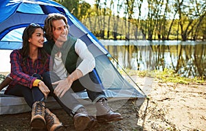 Camping away for the weekend is better than getting chocolates. an adventurous couple out camping together.