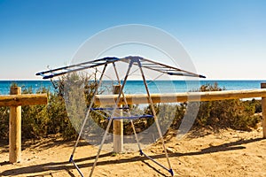 Camping on beach, empty clotheshorse photo