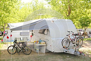 Camping camper caravan trees park bicycles