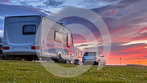 Camping caravans and cars sunset crop photo