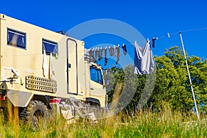 Camping. Clothes hanging to dry by rv lorry motorhome