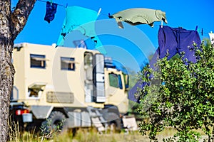 Camping. Clothes hanging to dry by rv lorry motorhome