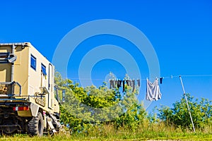 Camping. Clothes hanging to dry by rv lorry motorhome